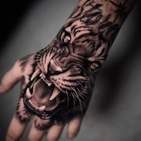 10 Powerful Tiger Hand Tattoos Tiger Hand Tattoo Hand Tattoos