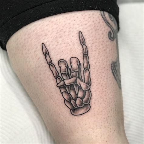 25 Frighteningly Cool Skeleton Hand Tattoo Designs