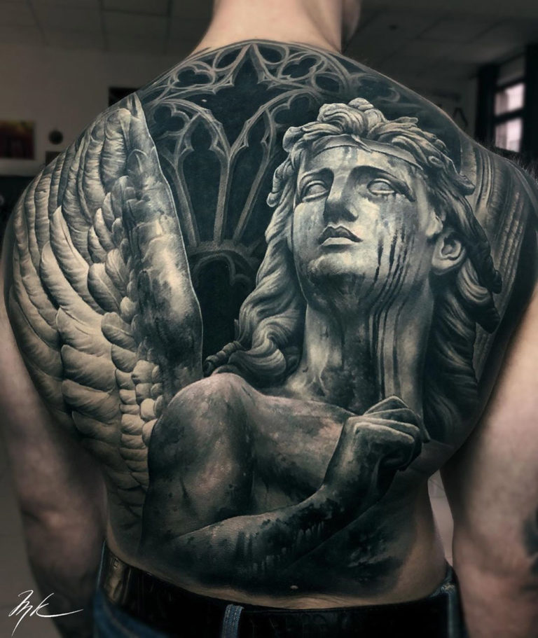 Angel Statue Tattoo Designs and Symbolism Explained