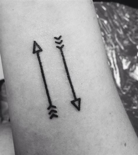 Improving Your Skills In Two Arrows Pointing Up Tattoo Meaning For A Fun And Playful Twist