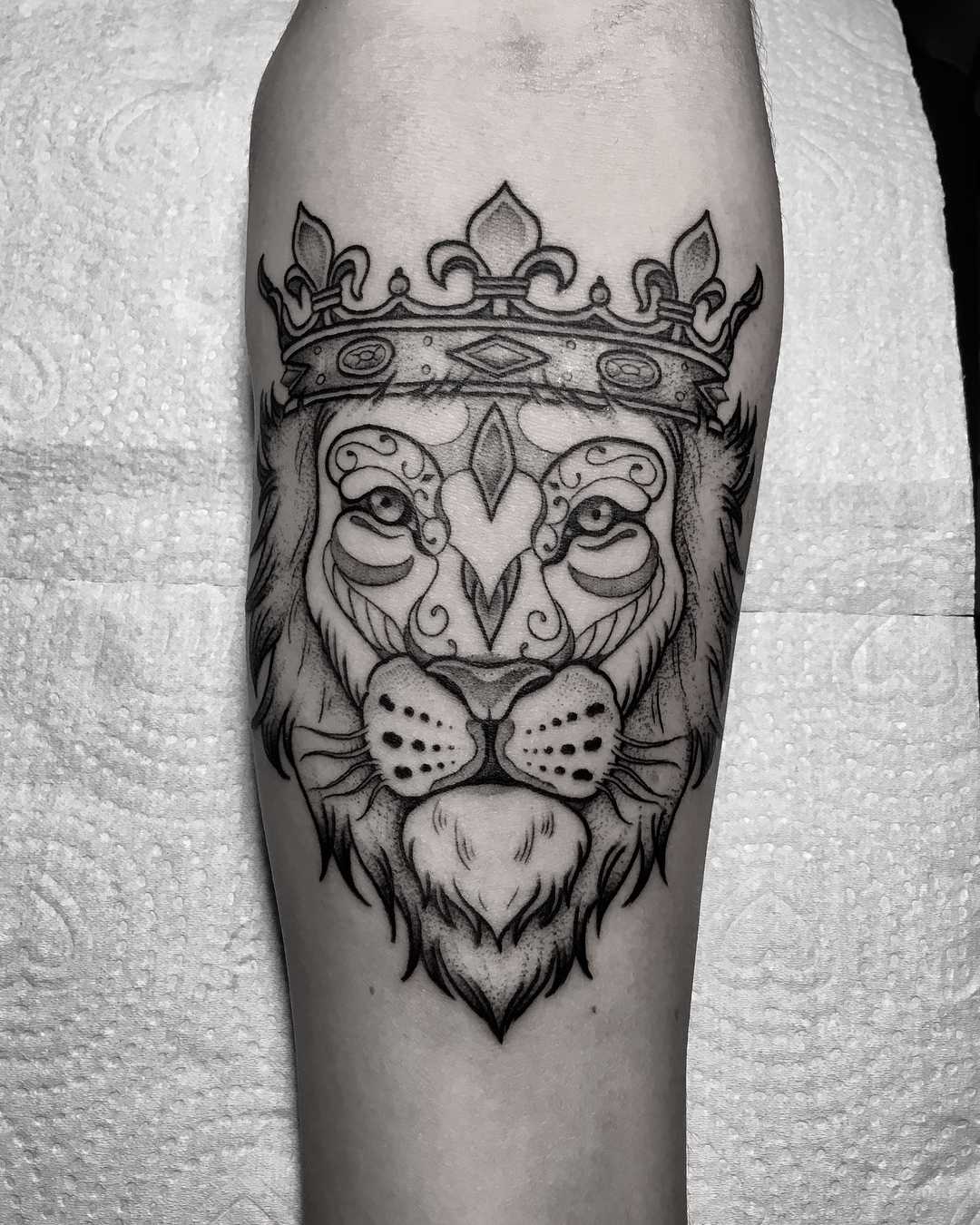 Lion with Crown Tattoo Designs and Symbolism Explained