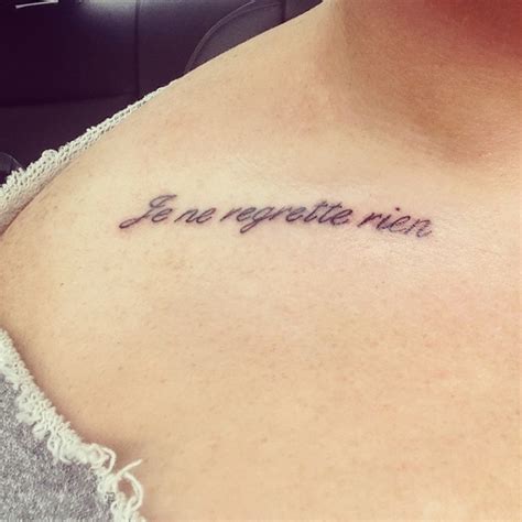 Regret Nothing Tattoo On Chest