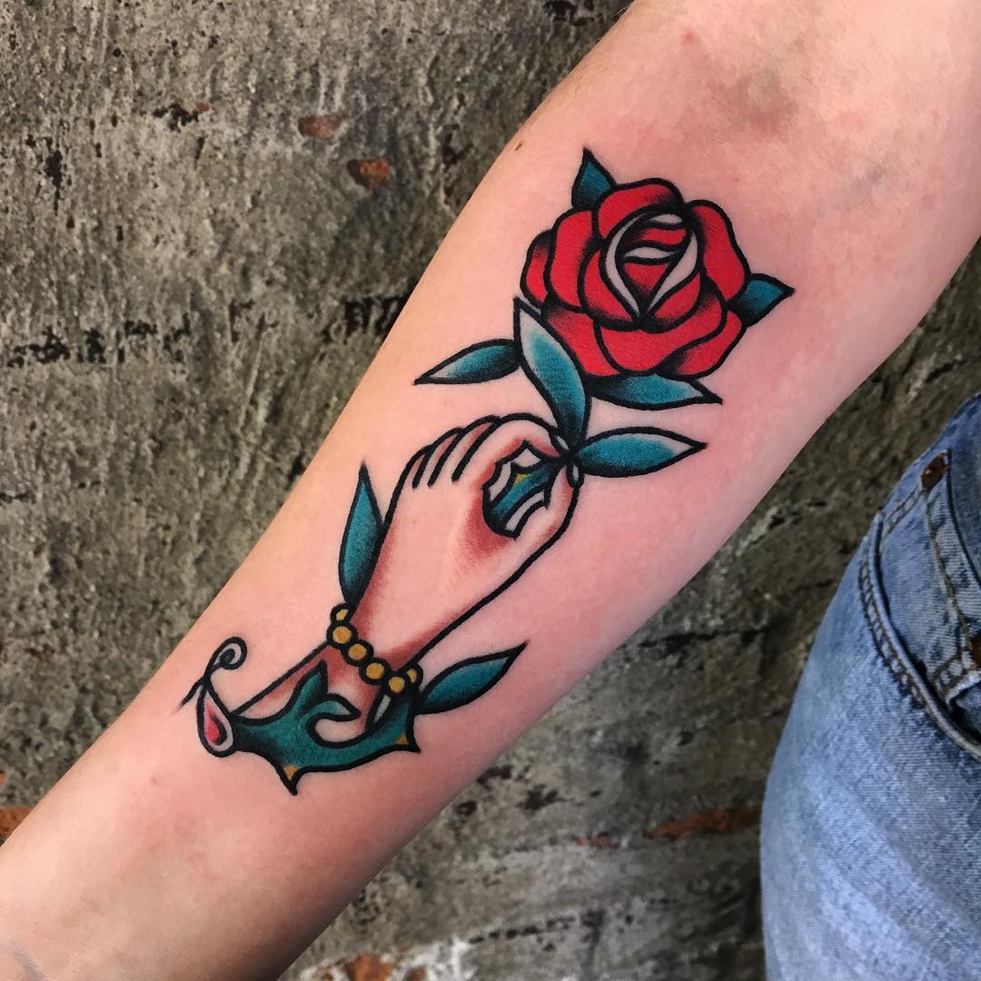 5 Meaningful Rose in Hand Tattoo Ideas