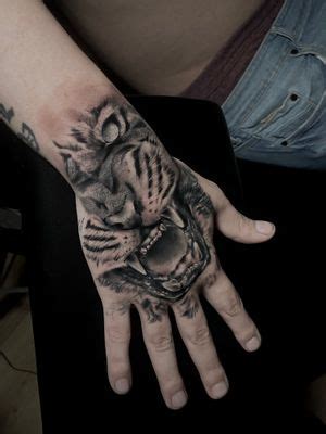 Tattoo Uploaded By Dan Villegas Tiger Hand Tattoo Tattoodo